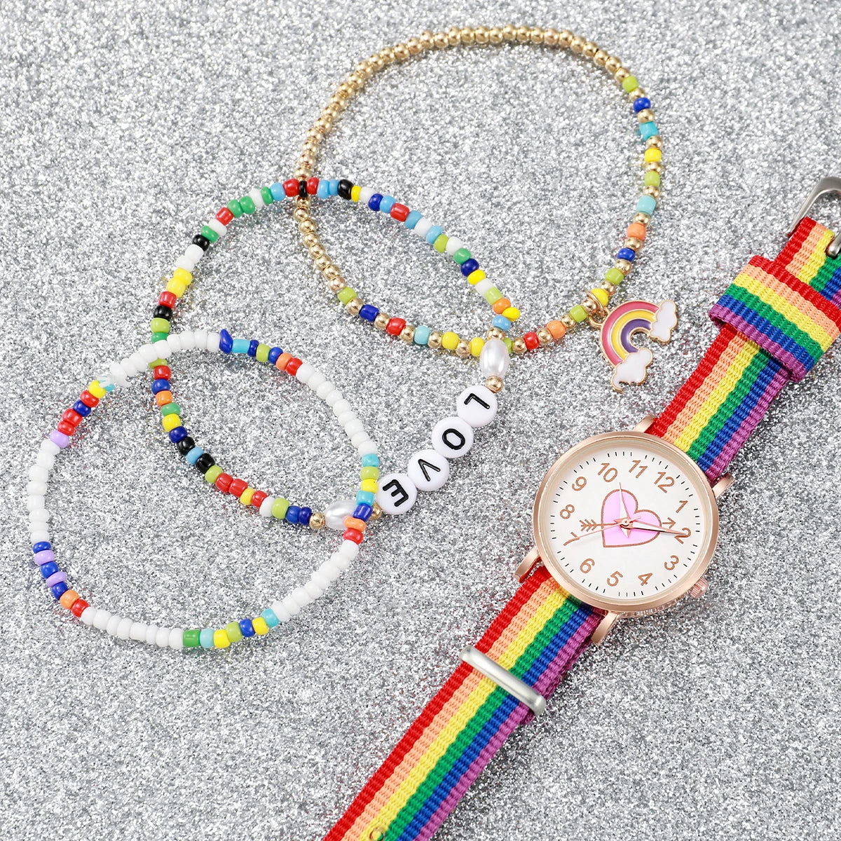 Pinchaqui.cl® Reloj de Mujer con Esfera de Corazón a la Moda y Pulseras Arcoíris